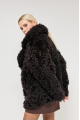 Double-sided curly sheepskin coat in dark chocolate color made of natural sheepskin in OVERSIZE style